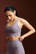 Amethyst sports bra for gym training with a stylish cross-back strap design
