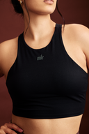 Back view of the Black cropped tank top paired with workout leggings