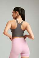 Back view of the Classic Gray cropped tank top paired with workout leggings