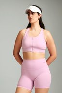 Bubblegum padded sports bra with a secure front zipper closure for easy wear