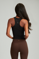 Close-up of a fitted tank top in black for women's fitness wear