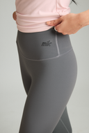 Close-up of ash OnTheGo leggings waistband, soft polyester-free fabric that stays in place during workouts