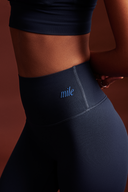 Close-up of ink blue OnTheGo leggings waistband, soft polyester-free fabric that stays in place during workouts