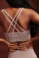 Lavender sports bra designed for workouts, gym sessions, and low to medium-impact activities