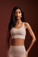 Lavender sports bra featuring a stylish cross-back design and secure fit