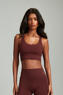 Maroon cross back sports bra designed for comfort, support, and active movement