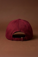 Maroon gym cap with an adjustable fit for fitness and everyday wear