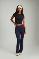Midnight Blue OnTheGo flare yoga pants designed for comfort, stretch, and everyday movement