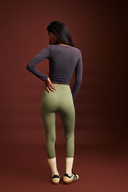 Mile Collective forest green gym leggings, full-length back view showing high-rise waistband