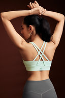 Mint sports bra for gym workouts featuring a secure front zipper closure