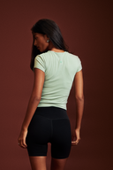 Pistachio baby tee suitable for casual wear, travel, and active lifestyles