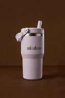 Woman carrying a light purple sports water bottle during a workout