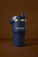 Woman carrying a navy blue sports water bottle during a workout