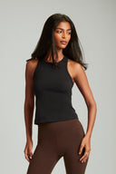 Woman wearing a fitted tank top in black for everyday workouts