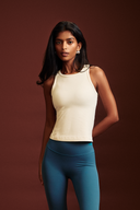 Woman wearing a fitted tank top layered with a baby tee style look