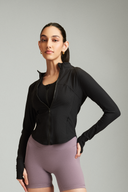 Woman wearing the Black OnTheGo gym jacket before a workout