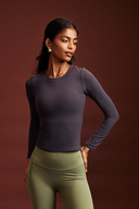 Woman wearing the Coal full sleeve gym top during a workout