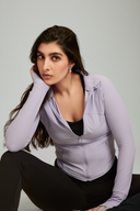 Woman wearing the Light Purple OnTheGo workout jacket for women