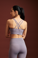 Women wearing Amethyst cross back bra for yoga, fitness classes, and active lifestyles