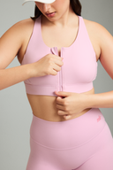Women wearing Bubblegum LevelUp zipper sports bra for gym training, yoga, and fitness classes