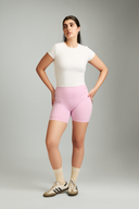 Women wearing Bubblegum OnTheGo athletic shorts with a supportive and flexible fit