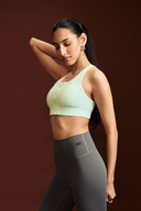 Women wearing Mint LevelUp zipper sports bra for fitness classes, running, and strength training