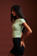 Women wearing Pistachio OnTheGo baby tee with soft stretch fabric and a sleek silhouette