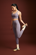 Women wearing amethyst workout leggings during yoga, squat-proof 4-way stretch fabric