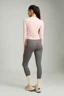 Women wearing ash grey workout leggings during yoga, squat-proof 4-way stretch fabric