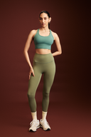 Women wearing forest green workout leggings during yoga, squat-proof 4-way stretch fabric