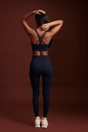 Women wearing ink blue workout leggings during yoga, squat-proof 4-way stretch fabric